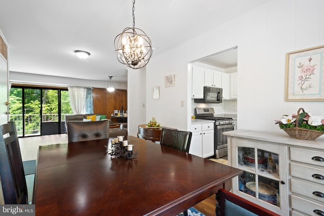 6034 Westchester Park Dr Unit 202, College Park, MD 20740 - dining space featuring a chandelier