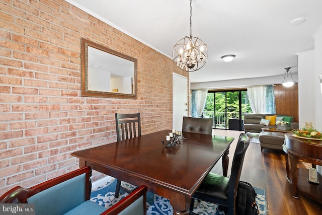 6034 Westchester Park Dr Unit 202, College Park, MD 20740 - dining space featuring wood finished floors, a chandelier, brick wall, and ornamental molding