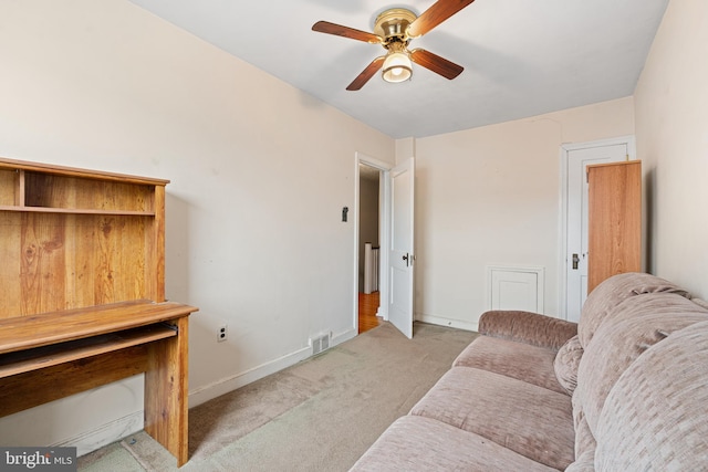 7164 Walker St, Philadelphia, PA 19135 - living area featuring light colored carpet, a ceiling fan, and baseboards