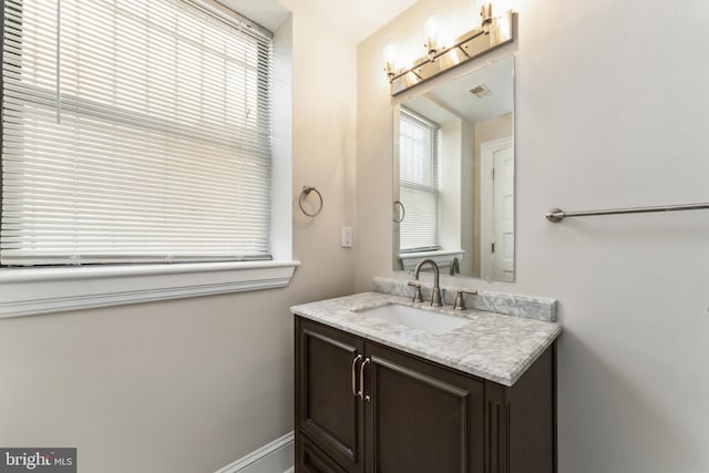1419 Clifton St NW Unit 101, Washington, DC 20009 - bathroom featuring plenty of natural light and vanity