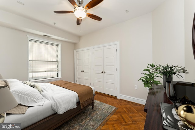 1419 Clifton St NW Unit 101, Washington, DC 20009 - bedroom with multiple closets, baseboards, and ceiling fan