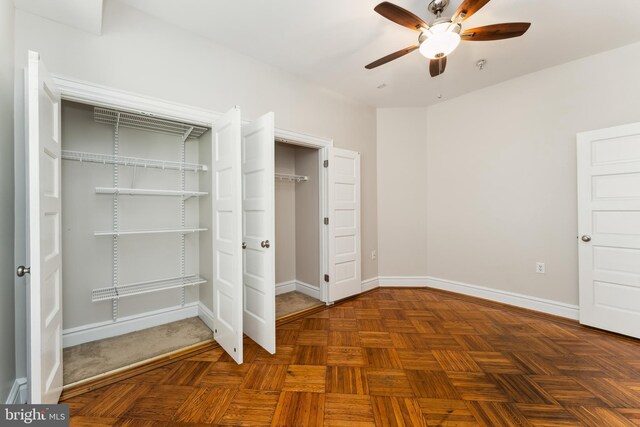 1419 Clifton St NW Unit 101, Washington, DC 20009 - unfurnished bedroom with baseboards and a ceiling fan