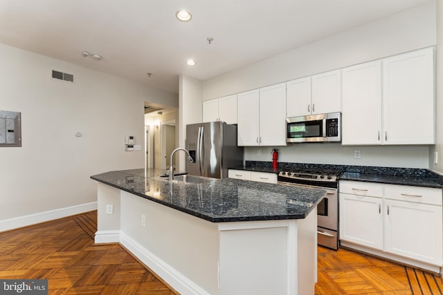 1419 Clifton St NW Unit 101, Washington, DC 20009 - kitchen featuring appliances with stainless steel finishes, baseboards, a sink, recessed lighting, and white cabinets