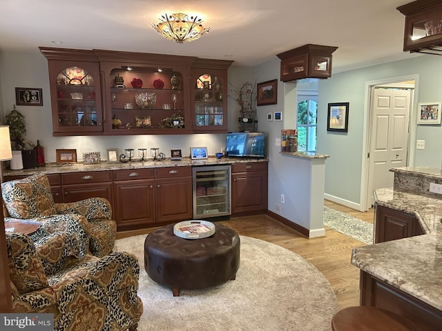 569 Highbank Rd, Severna Park, MD 21146 - indoor dry bar with beverage cooler, light wood finished floors, and baseboards