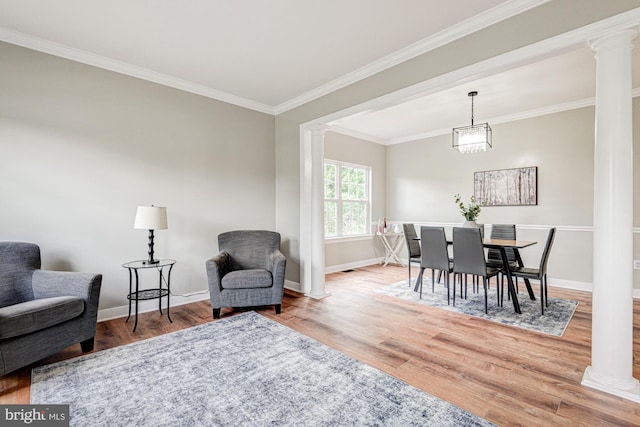 857 Barcelona St, Townsend, DE 19734 - dining area with ornate columns, wood finished floors, baseboards, and ornamental molding
