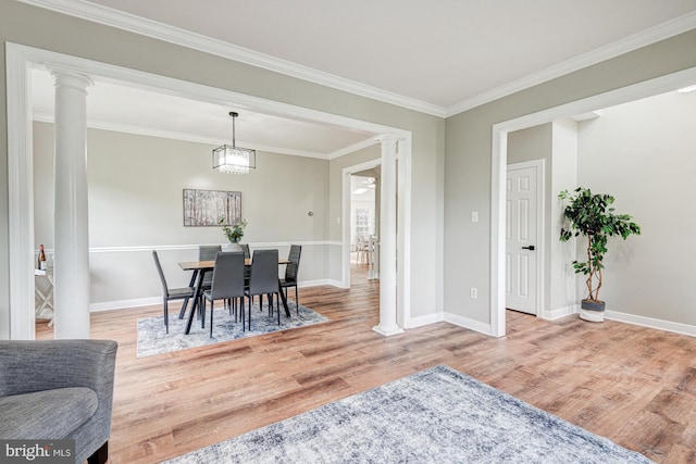 857 Barcelona St, Townsend, DE 19734 - dining room with ornate columns, wood finished floors, baseboards, and ornamental molding
