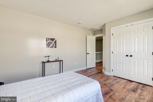 857 Barcelona St, Townsend, DE 19734 - bedroom with wood finished floors, a closet, and baseboards