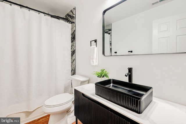 857 Barcelona St, Townsend, DE 19734 - full bathroom with toilet, a shower with curtain, vanity, and wood finished floors