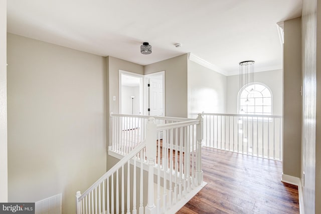 857 Barcelona St, Townsend, DE 19734 - corridor with an upstairs landing, wood finished floors, crown molding, and baseboards