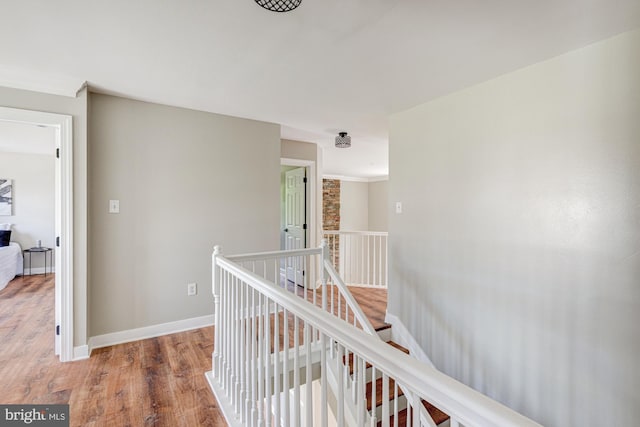 857 Barcelona St, Townsend, DE 19734 - hall featuring an upstairs landing, wood finished floors, and baseboards