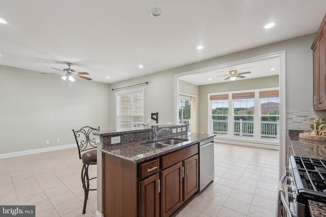 20677 Erskine Ter, Ashburn, VA 20147 - kitchen featuring ceiling fan, appliances with stainless steel finishes, a breakfast bar area, a sink, and recessed lighting