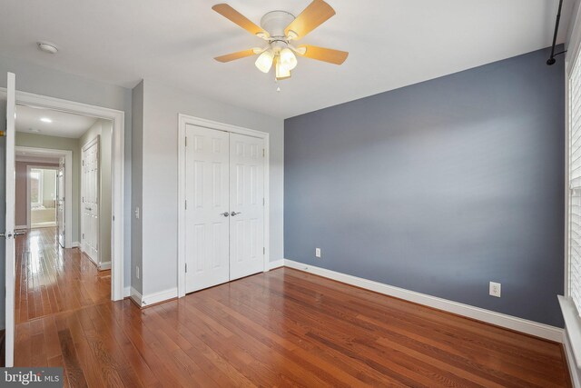 20677 Erskine Ter, Ashburn, VA 20147 - unfurnished bedroom featuring wood finished floors, baseboards, a closet, and ceiling fan