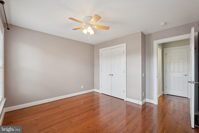 20677 Erskine Ter, Ashburn, VA 20147 - unfurnished bedroom featuring wood finished floors, baseboards, a closet, and ceiling fan
