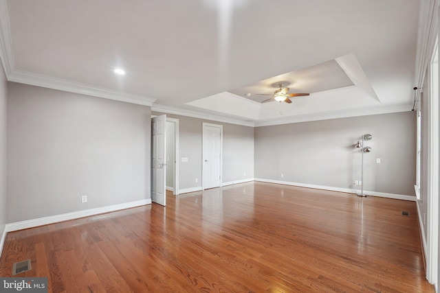 20677 Erskine Ter, Ashburn, VA 20147 - empty room with a ceiling fan, baseboards, a tray ceiling, ornamental molding, and wood finished floors
