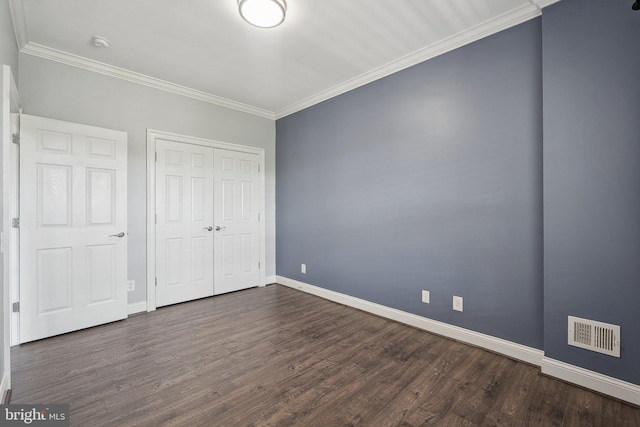 20677 Erskine Ter, Ashburn, VA 20147 - unfurnished bedroom featuring baseboards, dark wood-style flooring, a closet, and crown molding