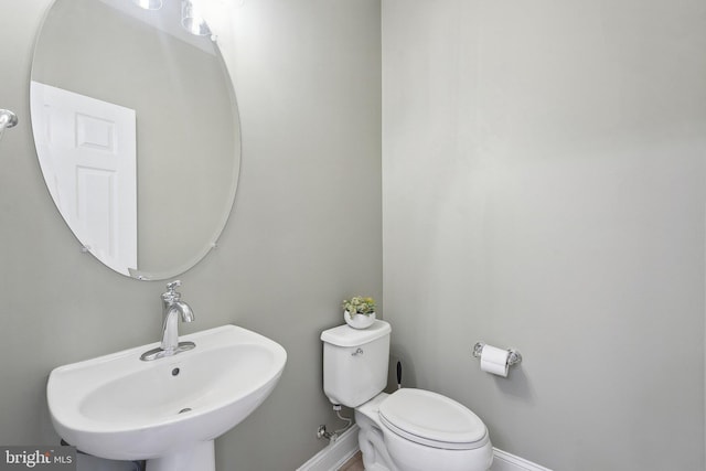 20677 Erskine Ter, Ashburn, VA 20147 - half bath with a sink, baseboards, and toilet