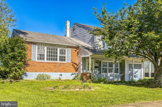 116 Layton Dr, New Castle, DE 19720 - view of front of house with a front lawn, brick siding, and a chimney