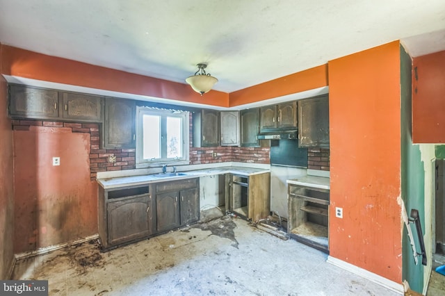 116 Layton Dr, New Castle, DE 19720 - kitchen featuring a sink, light countertops, and dark brown cabinetry