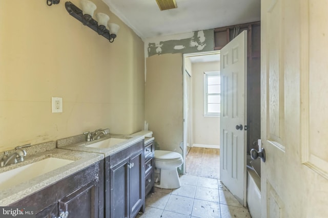 116 Layton Dr, New Castle, DE 19720 - bathroom with toilet, double vanity, and tile patterned floors