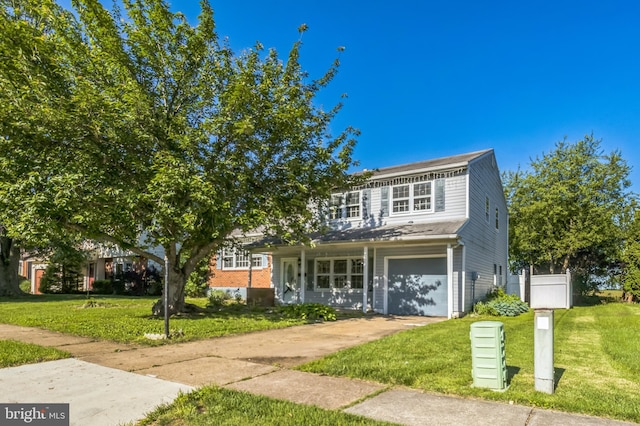 116 Layton Dr, New Castle, DE 19720 - view of front of property with a front lawn, concrete driveway, and a garage