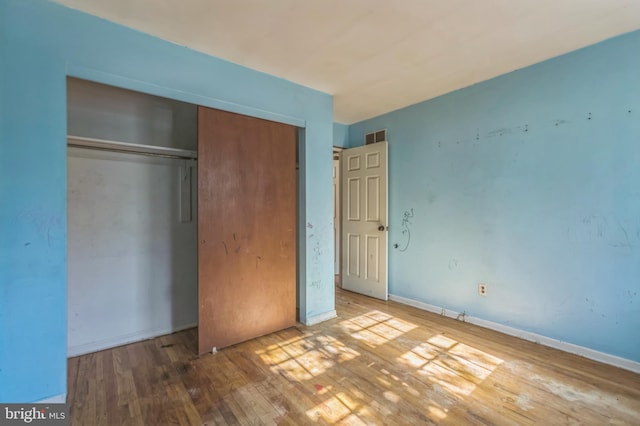 116 Layton Dr, New Castle, DE 19720 - unfurnished bedroom with hardwood / wood-style floors, a closet, and baseboards