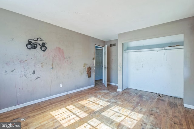116 Layton Dr, New Castle, DE 19720 - unfurnished bedroom with wood finished floors, baseboards, and a closet