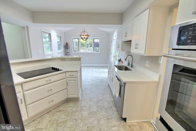 813 Pointer Ridge Dr, Gaithersburg, MD 20878 - kitchen with a sink, stainless steel appliances, light countertops, a chandelier, and white cabinetry