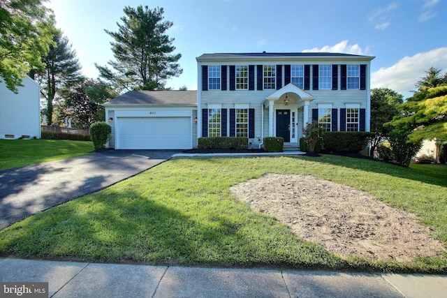 813 Pointer Ridge Dr, Gaithersburg, MD 20878 - colonial-style house with driveway, a garage, and a front yard