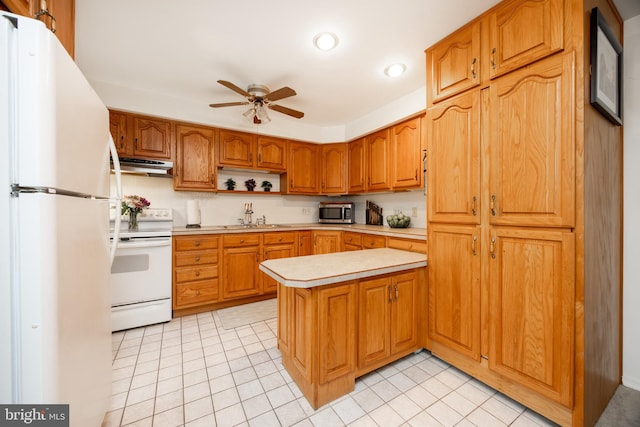 200 Maplewood Dr Unit 20, Pottstown, PA 19464 - kitchen featuring white appliances, under cabinet range hood, a sink, ceiling fan, and light countertops