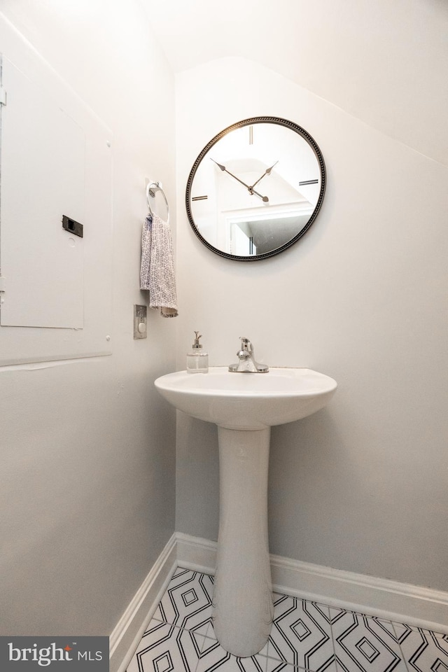 200 Maplewood Dr Unit 20, Pottstown, PA 19464 - bathroom featuring tile patterned floors, baseboards, and a sink