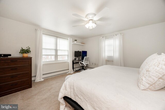 200 Maplewood Dr Unit 20, Pottstown, PA 19464 - bedroom with multiple windows, light colored carpet, a baseboard heating unit, and an office area