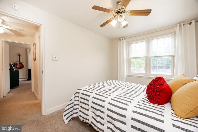 200 Maplewood Dr Unit 20, Pottstown, PA 19464 - bedroom featuring light carpet, baseboards, a baseboard heating unit, and ceiling fan