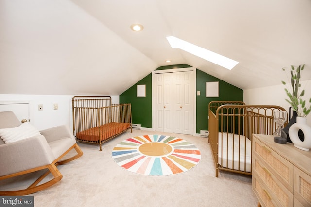 200 Maplewood Dr Unit 20, Pottstown, PA 19464 - bedroom featuring a skylight, carpet, vaulted ceiling, a closet, and a baseboard radiator
