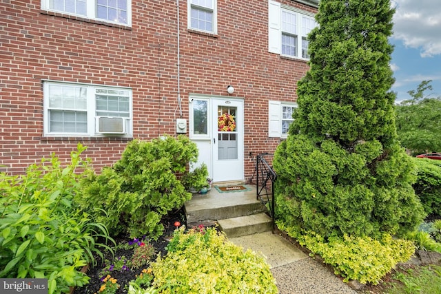 200 Maplewood Dr Unit 20, Pottstown, PA 19464 - property entrance with brick siding and cooling unit