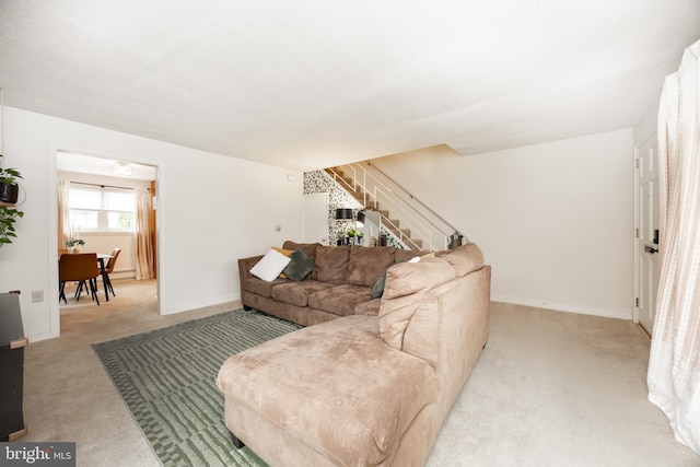 200 Maplewood Dr Unit 20, Pottstown, PA 19464 - living area featuring light colored carpet, stairs, baseboards, and baseboard heating