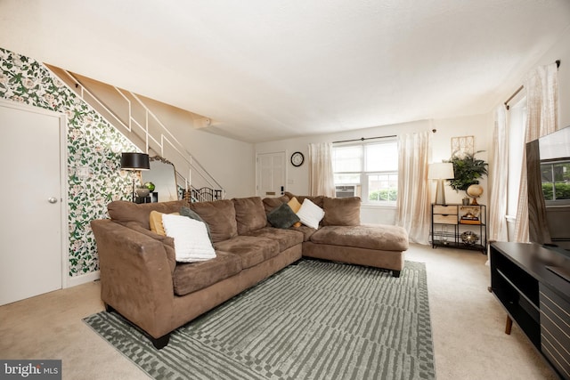 200 Maplewood Dr Unit 20, Pottstown, PA 19464 - carpeted living room with stairs and wallpapered walls