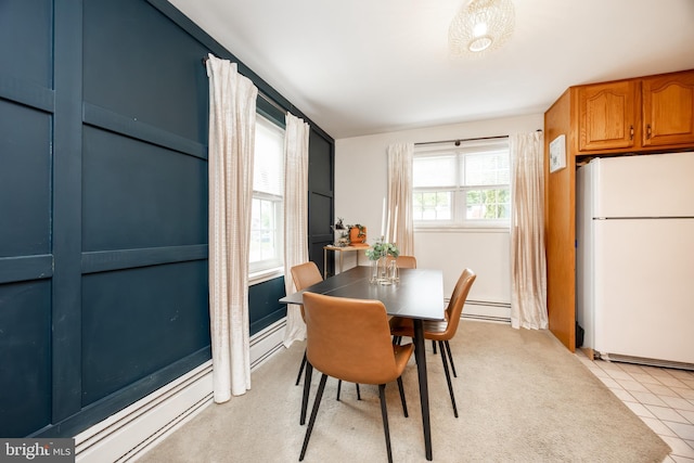 200 Maplewood Dr Unit 20, Pottstown, PA 19464 - dining area featuring a baseboard radiator and light tile patterned floors