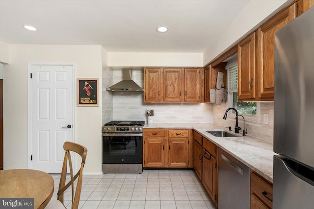 8 Crestwood Dr, Hamilton, NJ 08690 - kitchen featuring stainless steel appliances, wall chimney exhaust hood, a sink, brown cabinets, and recessed lighting