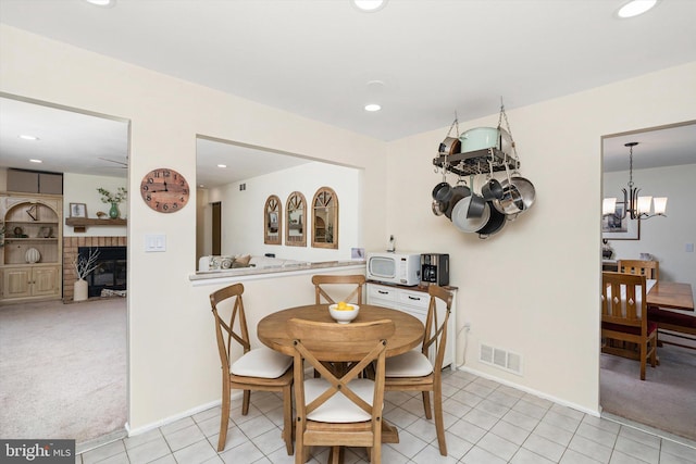 8 Crestwood Dr, Hamilton, NJ 08690 - dining room featuring a chandelier, baseboards, recessed lighting, light carpet, and a fireplace