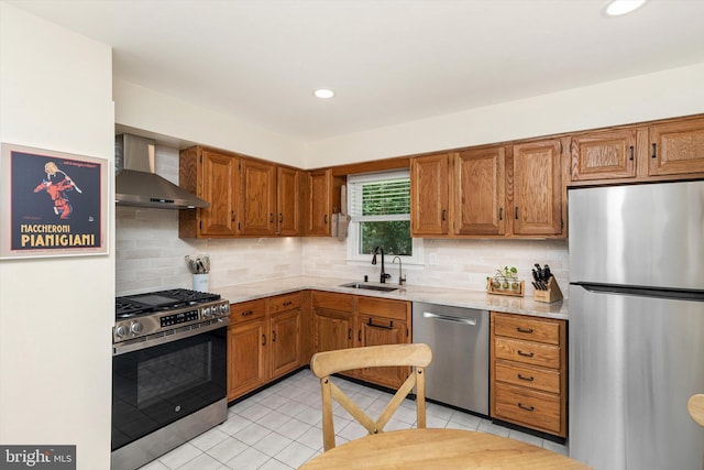 8 Crestwood Dr, Hamilton, NJ 08690 - kitchen featuring stainless steel appliances, wall chimney exhaust hood, a sink, brown cabinets, and recessed lighting
