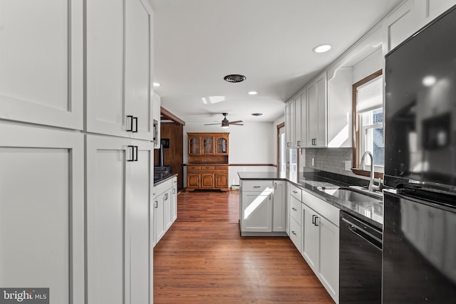 18000 Davis Ln, Boonsboro, MD 21713 - kitchen featuring black appliances, a sink, dark wood finished floors, decorative backsplash, and white cabinets