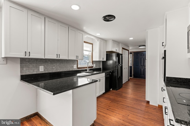 18000 Davis Ln, Boonsboro, MD 21713 - kitchen featuring black appliances, a sink, dark wood finished floors, white cabinetry, and a peninsula