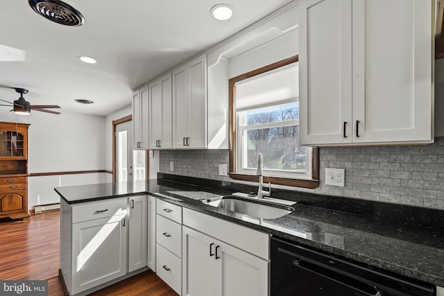 18000 Davis Ln, Boonsboro, MD 21713 - kitchen featuring a sink, black dishwasher, a peninsula, decorative backsplash, and ceiling fan