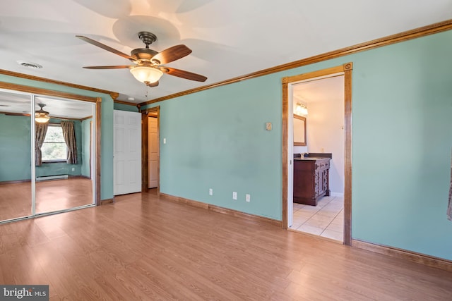 18000 Davis Ln, Boonsboro, MD 21713 - unfurnished bedroom featuring baseboard heating, baseboards, crown molding, light wood finished floors, and ceiling fan
