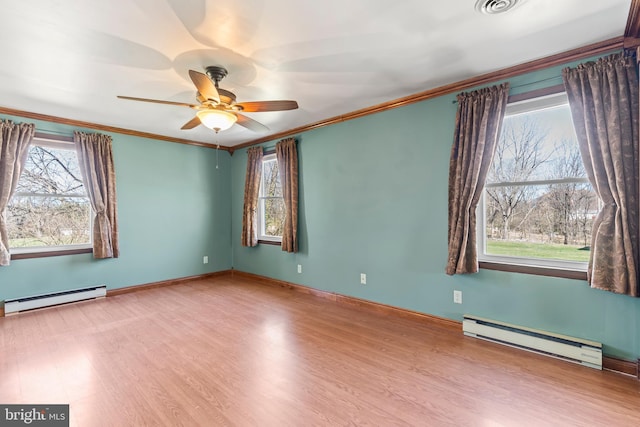 18000 Davis Ln, Boonsboro, MD 21713 - empty room featuring a baseboard heating unit, crown molding, wood finished floors, and a ceiling fan