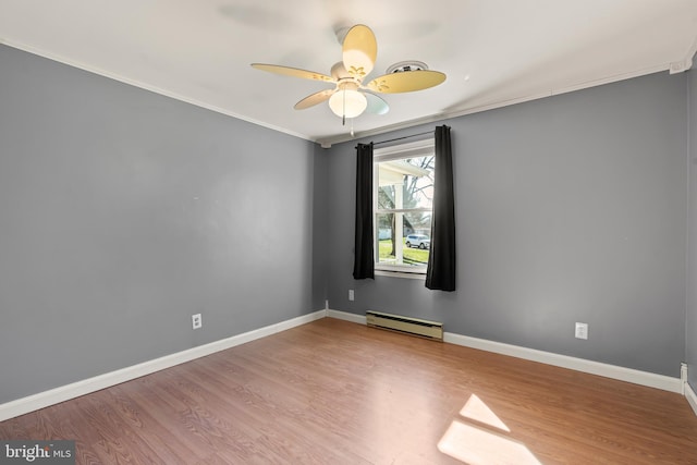 18000 Davis Ln, Boonsboro, MD 21713 - empty room featuring a baseboard heating unit, wood finished floors, ceiling fan, ornamental molding, and baseboards