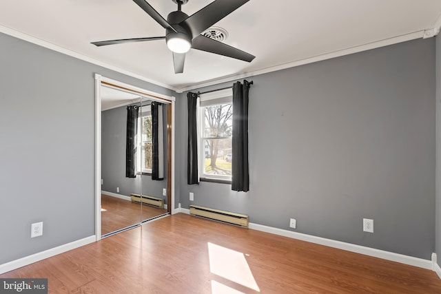 18000 Davis Ln, Boonsboro, MD 21713 - unfurnished bedroom with a baseboard radiator, crown molding, wood finished floors, baseboards, and ceiling fan