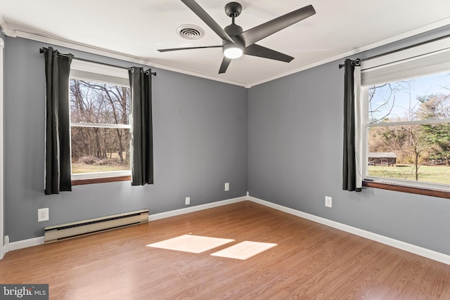 18000 Davis Ln, Boonsboro, MD 21713 - unfurnished room with a baseboard heating unit, wood finished floors, crown molding, ceiling fan, and baseboards