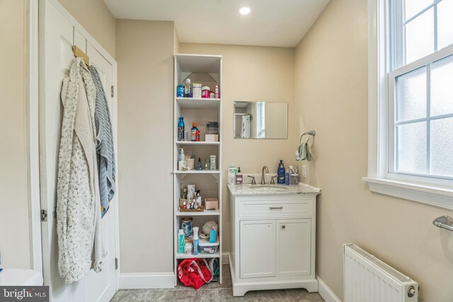 3171 Memphis St, Philadelphia, PA 19134 - bathroom featuring radiator heating unit, vanity, and baseboards