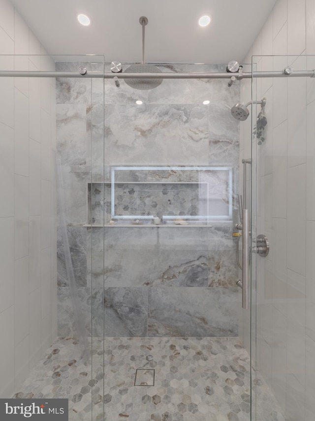 full bath with a shower stall and recessed lighting